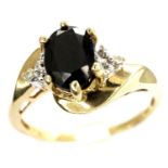 9ct gold dress ring set with a central sapphire and diamonds, size P, 2.3g. P&P Group 1 (£14+VAT for