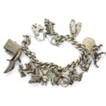 Hallmarked silver charm bracelet with a hallmarked silver padlock clasp, safety chain and eighteen