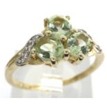 10ct gold emerald trilogy ring set with CZ stones, size N/O, 2.4g. P&P Group 1 (£14+VAT for the