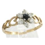 9ct gold flower ring set with sapphire and CZ stones and pierced heart shoulders, size R, 1.3g. P&