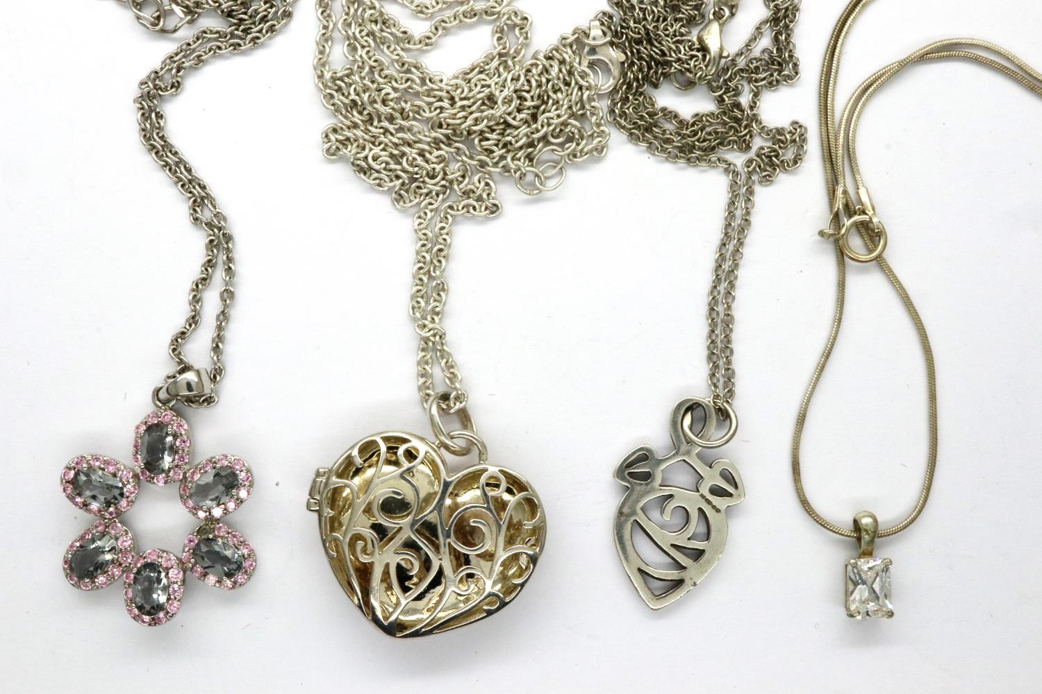 Four 925 silver pendant necklaces including a locket, largest chain L: 64 cm. P&P Group 1 (£14+VAT
