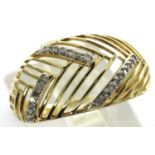 10ct gold Art Deco style pierced ring set with diamonds, size O, 1.7g. P&P Group 1 (£14+VAT for