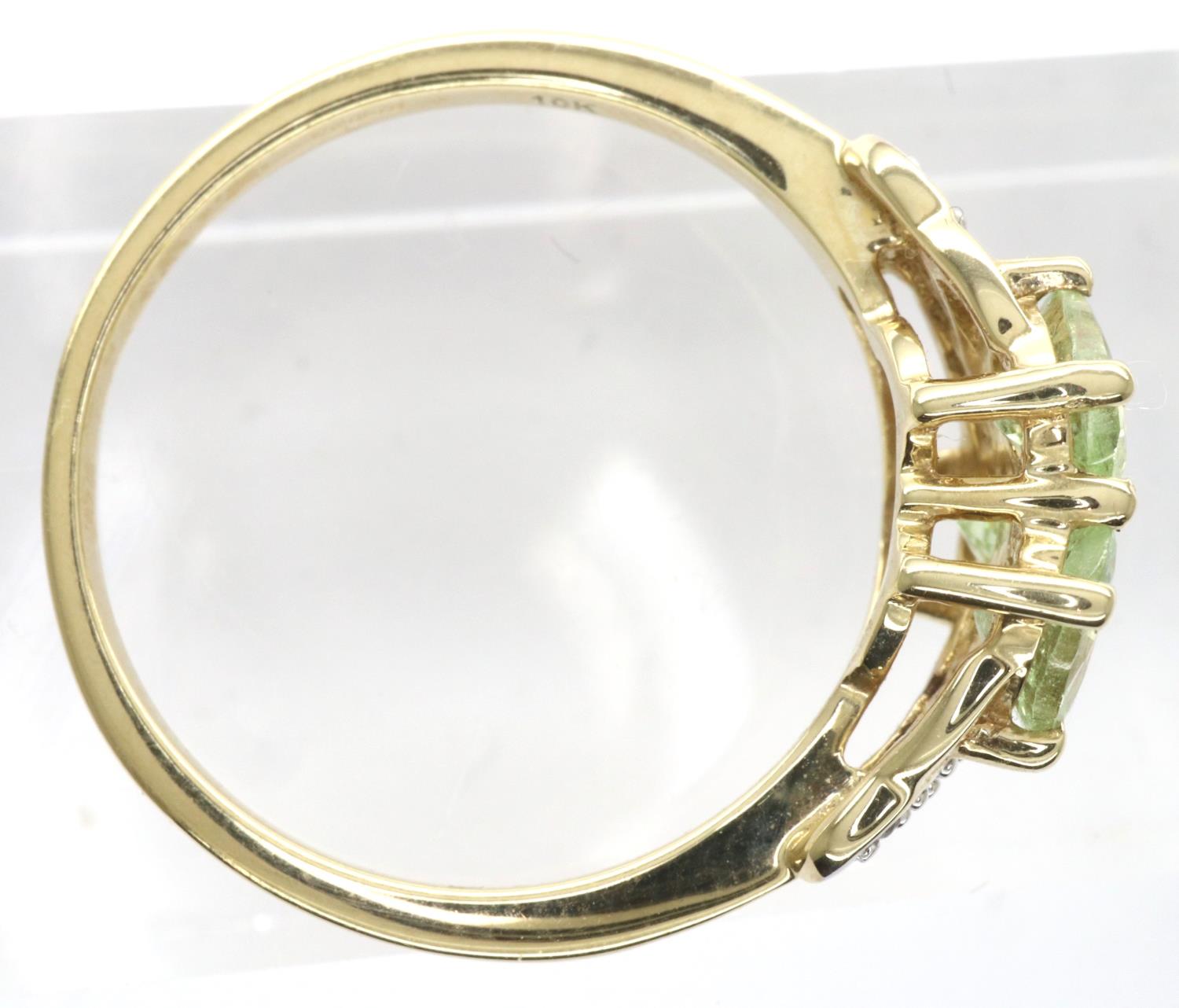 10ct gold emerald trilogy ring set with CZ stones, size N/O, 2.4g. P&P Group 1 (£14+VAT for the - Image 2 of 3