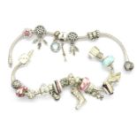 Two Pandora charm bracelets, one with six charms and one with sixteen charms, clasp to one