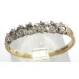 9ct gold ring set with seven diamonds, size N, 1.2g. P&P Group 1 (£14+VAT for the first lot and £1+