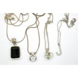 Four 925 silver pendant necklaces including a J pendant, longest chain L: 60 cm. P&P Group 1 (£14+