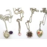 Four 925 silver pendant necklaces including a pierced heart pendant, largest chain L: 48 cm. P&P