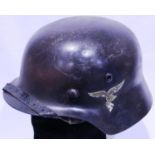 German WWII period Luftwaffe helmet with leather liner and chin strap. P&P Group 2 (£18+VAT for