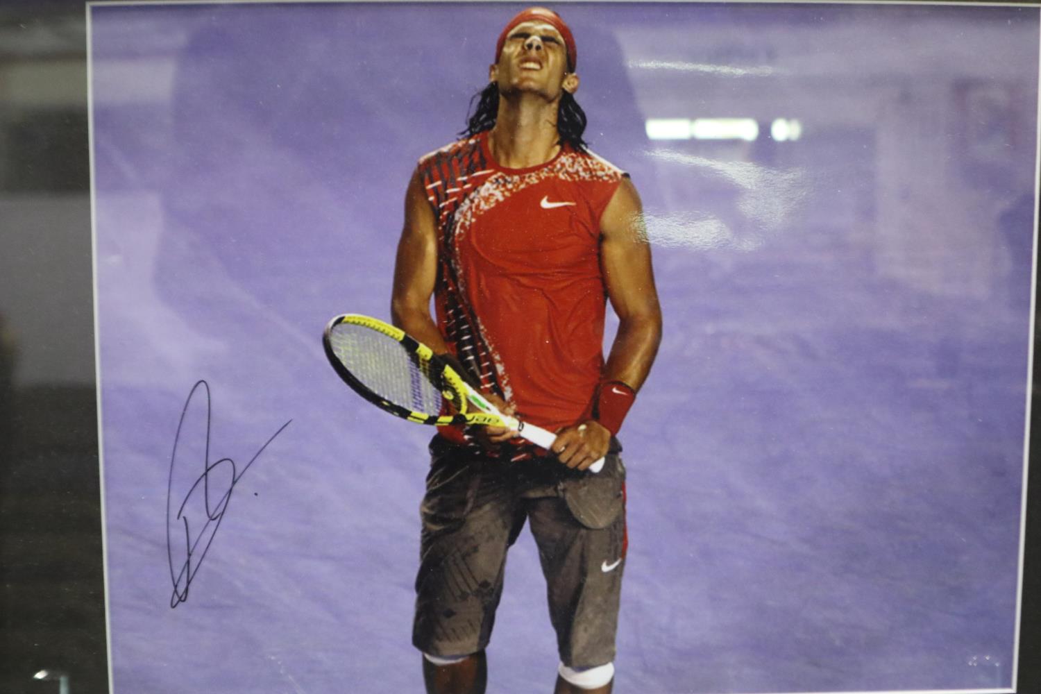 Framed signed photograph of Rafael Nadal with COA, 39 x 29 cm. Not available for in-house P&P