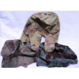 Three camouflage helmet covers, one dated 1944. P&P Group 1 (£14+VAT for the first lot and £1+VAT