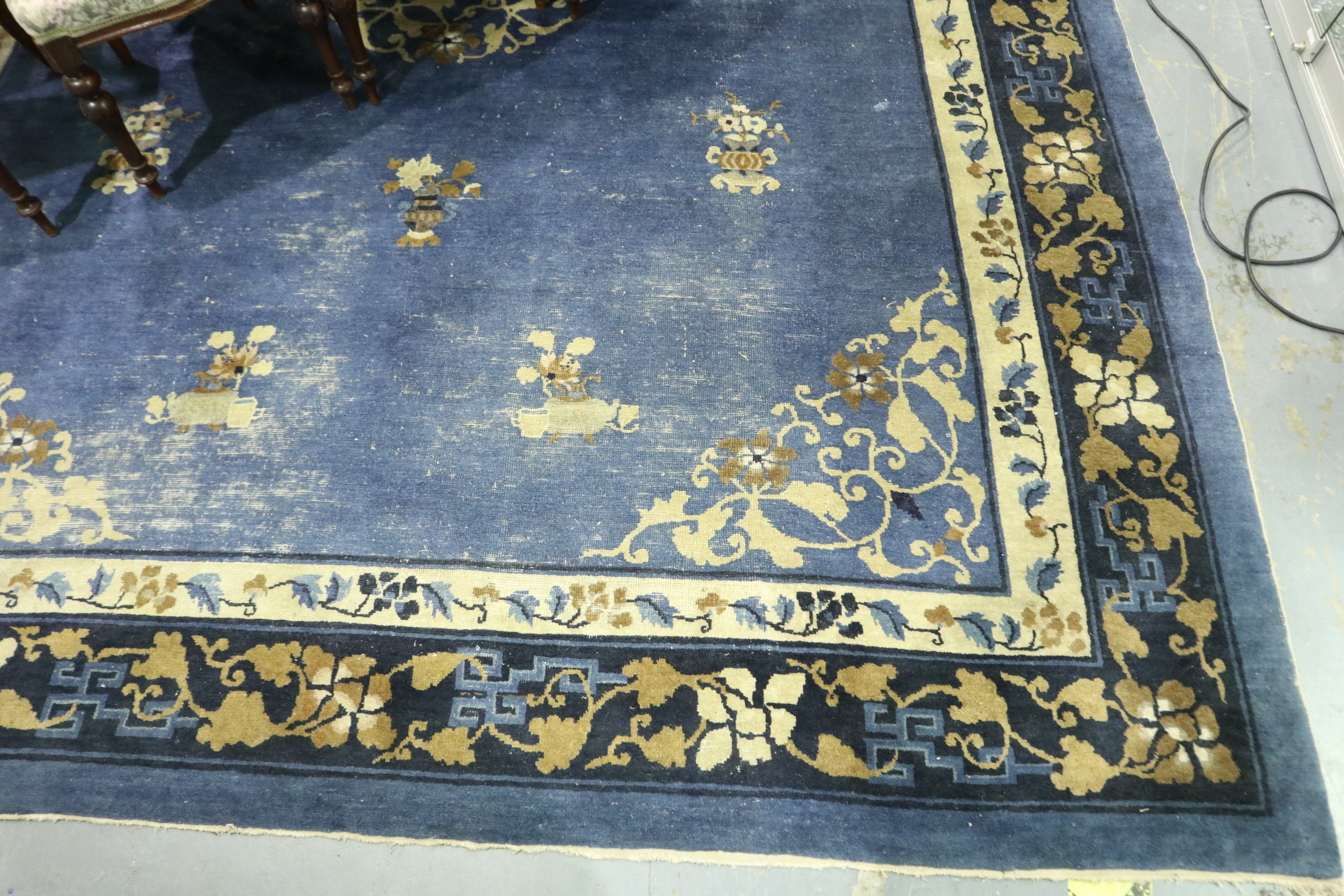 Late 19th/early 20th century floor rug with designs against a blue ground, 330 x 200 cm. Not