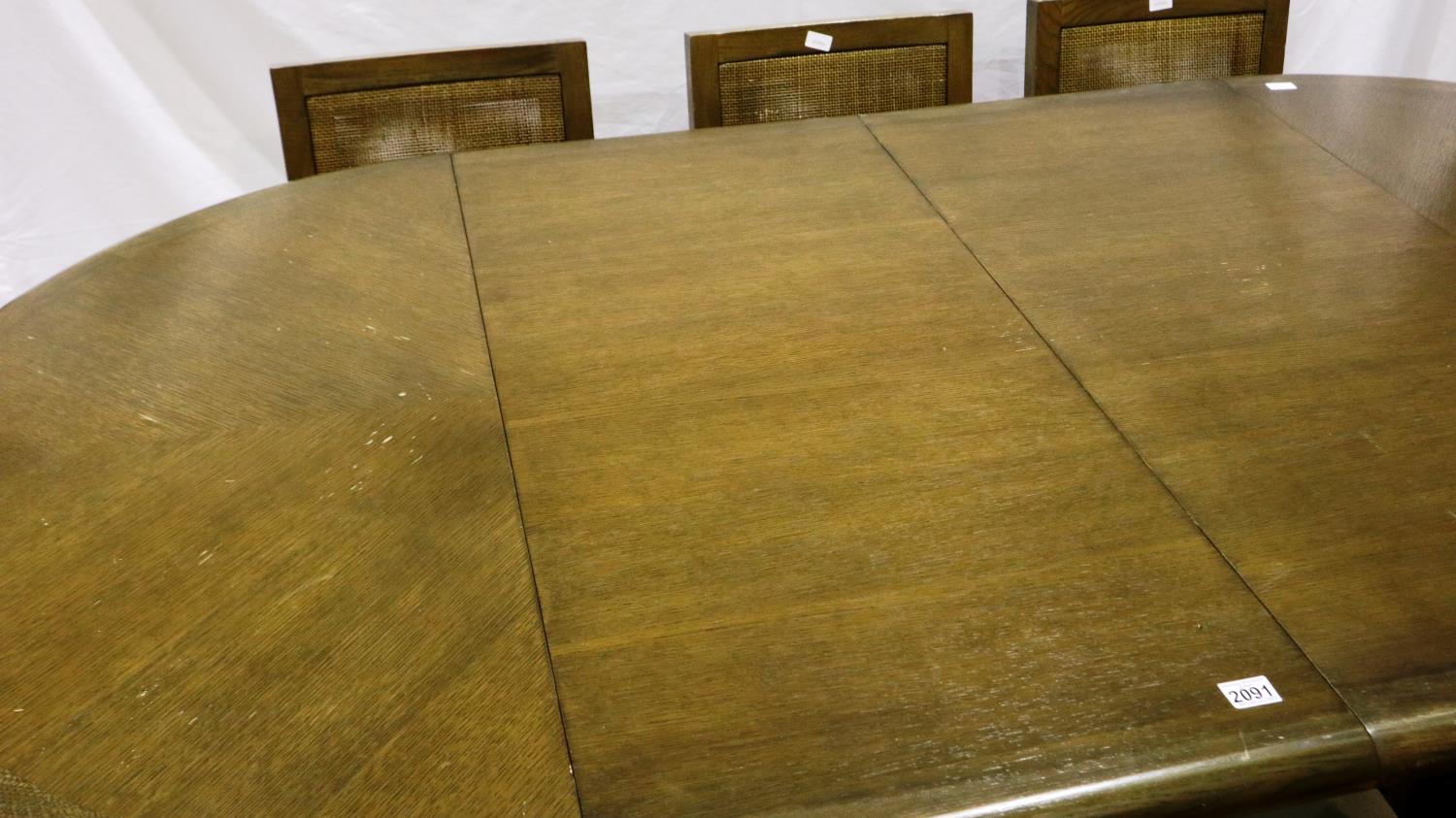 A modern oak circular extending dining table with two additional leaves and a set of eight chairs - Image 2 of 8