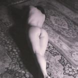 China Hamilton (1946-2018): pencil signed photographic print, Naked Upon A Carpet, stamped,