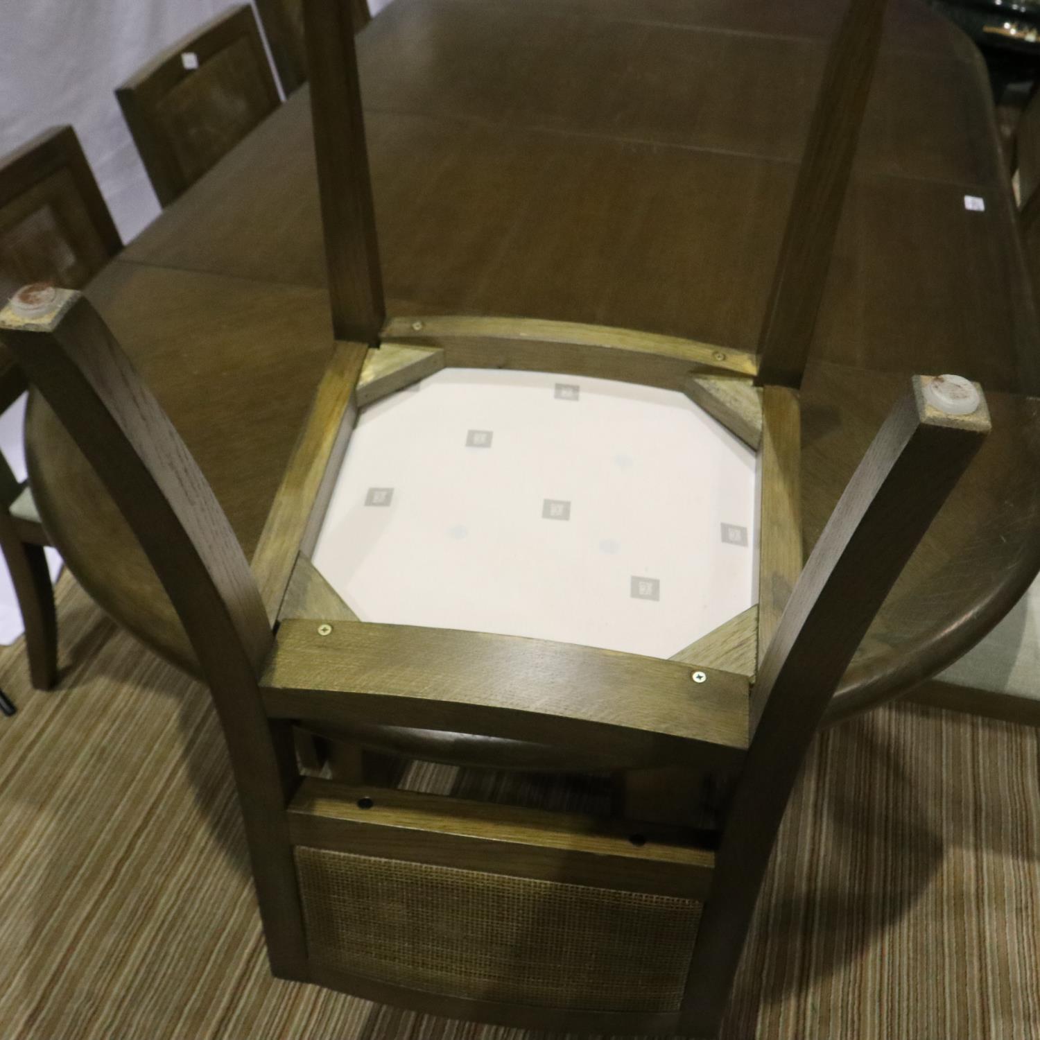 A modern oak circular extending dining table with two additional leaves and a set of eight chairs - Image 7 of 8