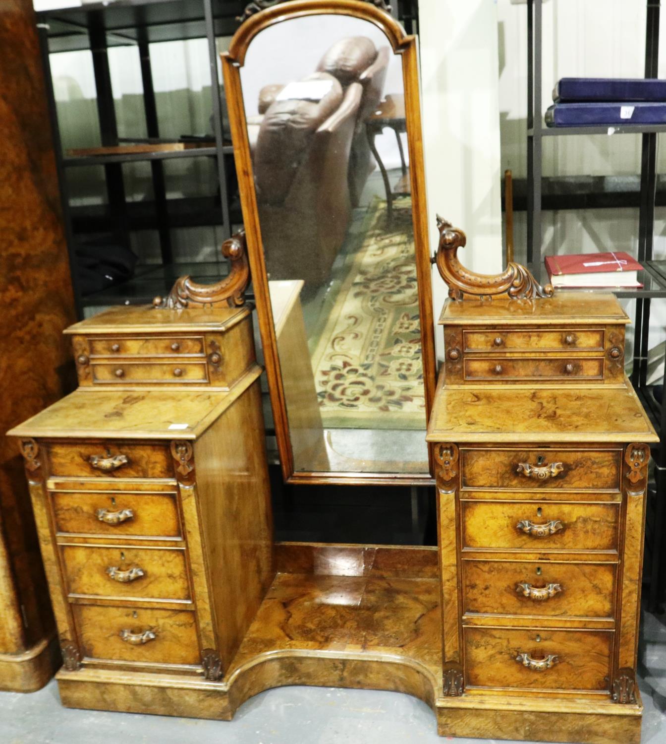 Mid 19th century burr walnut dresser, having a large swing mirror flanked by two pedestals of