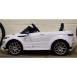 Childs electric ride on Range Rover with charger and key. Not available for in-house P&P