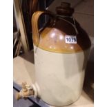 Stoneware flagon with single handle and pouring tap, H: 45 cm. Not available for in-house P&P