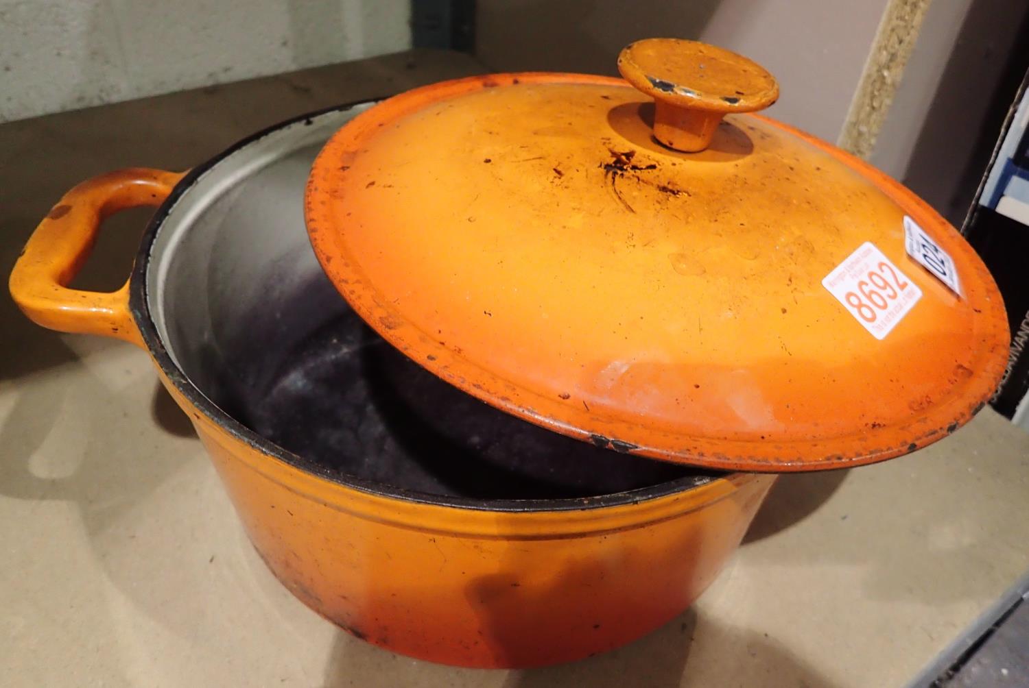Le Creuset Orange cast iron two handed casserole pot, D: 25 cm. Not available for in-house P&P