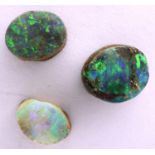 Loose stones: three rough cut opals, combined 0.6g. P&P Group 1 (£14+VAT for the first lot and £1+