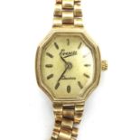 Everite: boxed 9ct gold ladies quartz wristwatch on a 9ct gold bracelet with safety chain,