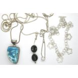 Four 925 silver necklaces, three with stone set pendants, longest chain L: 60 cm. P&P Group 1 (£14+