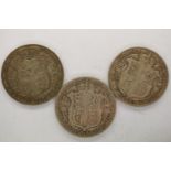 Three silver half crowns of George V: 1916, 1918 and 1927. A bronze medal by the Royal Mint, '