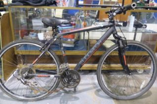 Muddy Fox Tempo 19 inch frame, 21 speed road bike with front suspension, equipped with Shimano