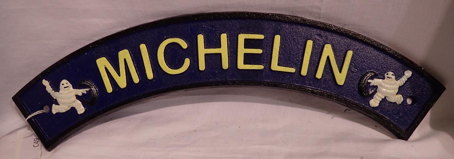 Cast iron curved Michelin sign, W: 30 cm. P&P Group 1 (£14+VAT for the first lot and £1+VAT for