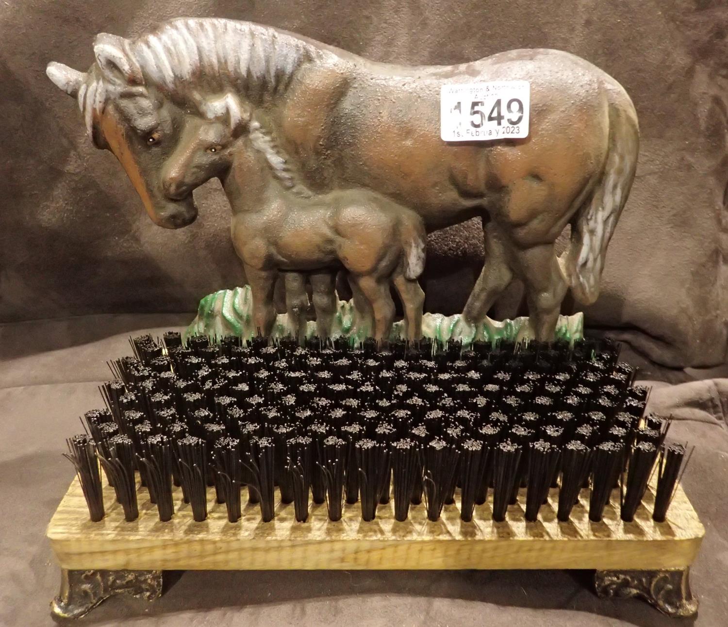 New unused cast iron horse and foal boot brush on wooden base, H: 25 cm. P&P Group 2 (£18+VAT for