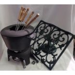 Boxed fondue set and a cast iron bookstand. Not available for in-house P&P