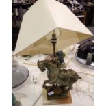 Bronzed cast iron table lamp in the form of a horse, on a marble base with cream shade, H: 61 cm.