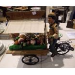 Large figurine of a vegetable seller on bicycle, L: 50 cm. Not available for in-house P&P