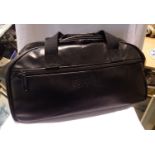 Black leather holdall by Revelation. P&P Group 3 (£25+VAT for the first lot and £5+VAT for