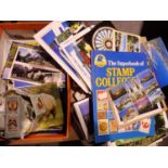 Large quantity of postcards, loose stamps, The Superbook of Stamp Collecting and a further stamp