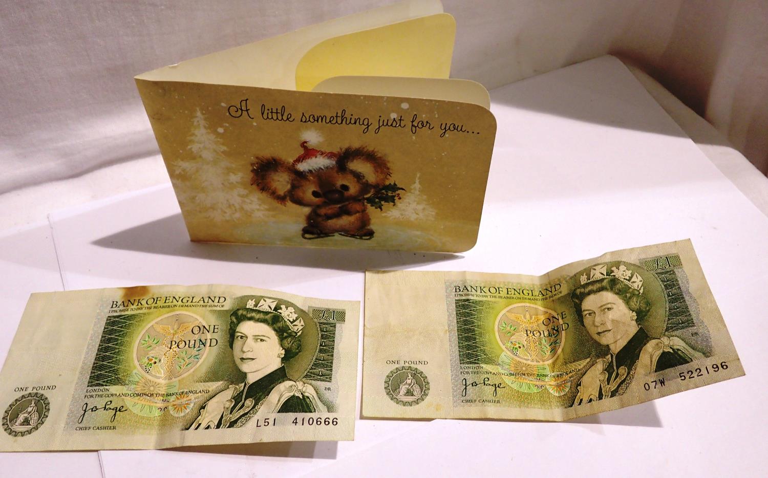 Two vintage one pound notes in a gift card. P&P Group 1 (£14+VAT for the first lot and £1+VAT for