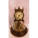 Brass anniversary clock with enamel face, in a glass dome, not working at lotting. P&P Group 2 (£