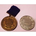 Knowsley School Punctuality prize table medal in high relief white metal by Alman of London,