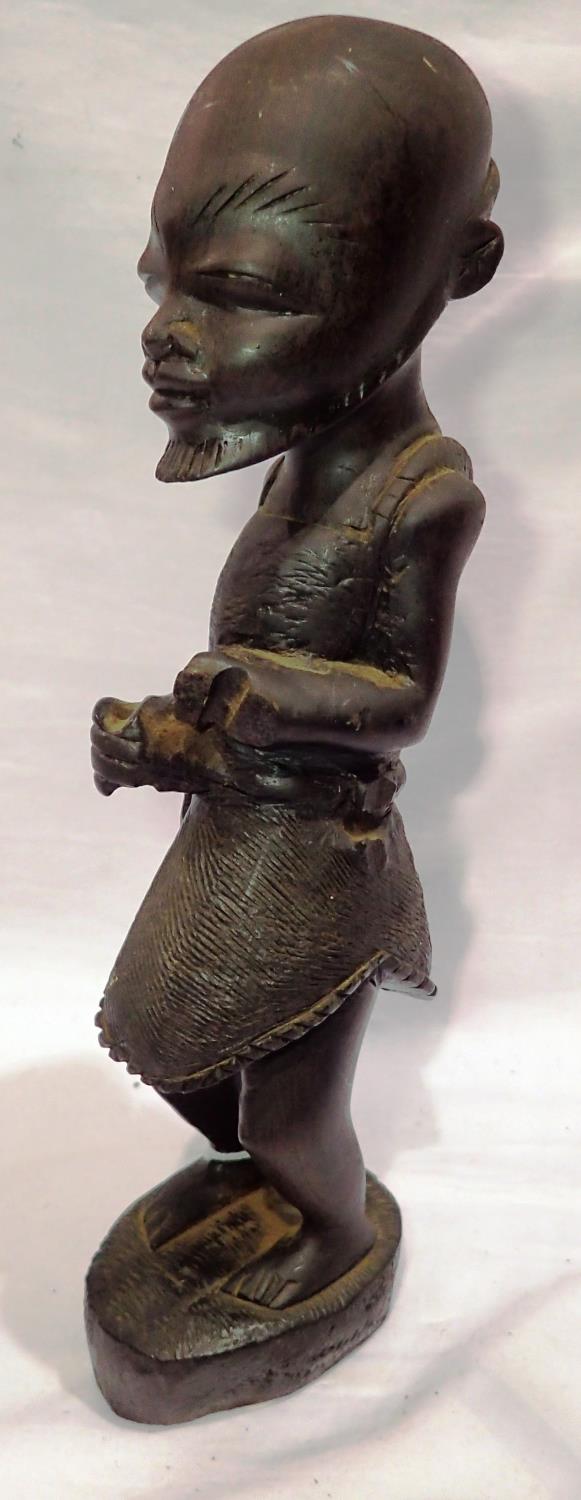 Early carved Tribal Art figure of a warrior, H: 26 cm. P&P Group 2 (£18+VAT for the first lot and £