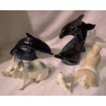 Two Beswick pigs and two Poole dolphins, largest 20 cm. P&P Group 3 (£25+VAT for the first lot