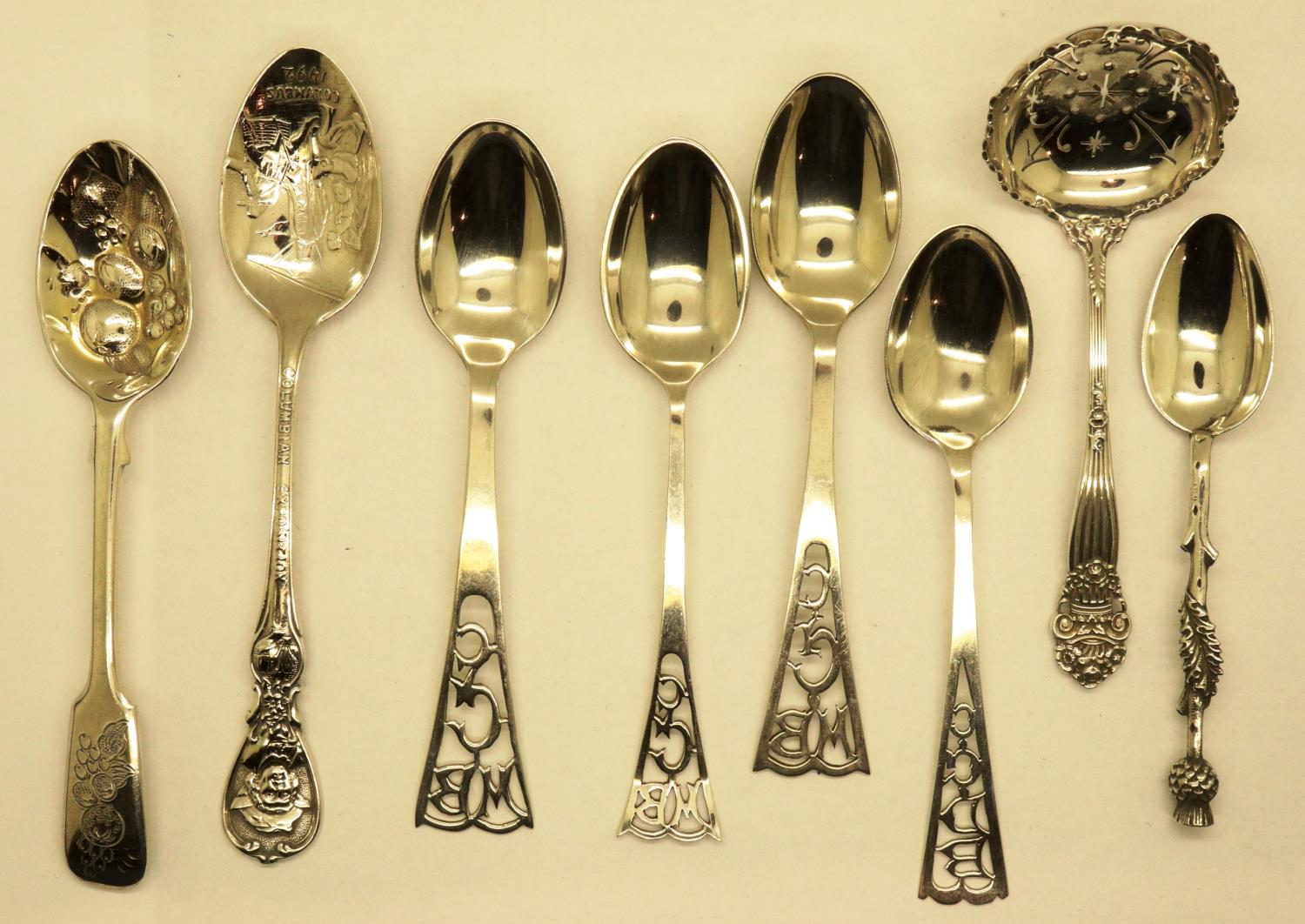 Eight mixed hallmarked silver spoons including a tea strainer, combined 133g. P&P Group 1 (£14+VAT