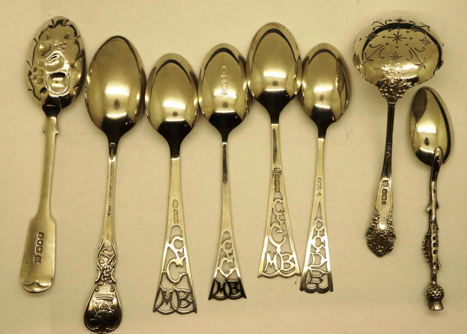 Eight mixed hallmarked silver spoons including a tea strainer, combined 133g. P&P Group 1 (£14+VAT - Image 2 of 3