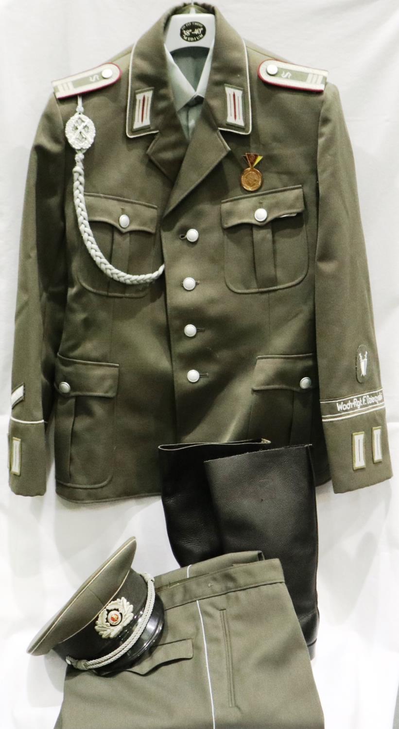 East German Armoured Division NCO uniform, comprising tunic, trousers, boots, and visor cap with