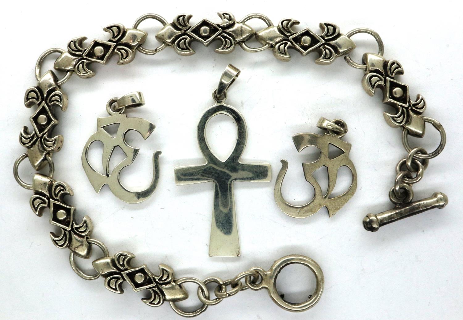 925 silver bracelet and three mixed pendants including an Ankh. P&P Group 1 (£14+VAT for the first