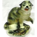 19th century glazed ceramic study of a Bobcat on a naturalistic base, H: 24 cm, light crazing