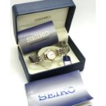 SEIKO: Boxed SQ50 ladies wristwatch on a stainless steel and gold plated bracelet, not working at