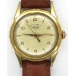 ROAMER: gents automatic gold plated wristwatch, with circular dial on a brown leather strap, lens