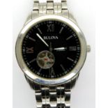 BULOVA: gents steel cased automatic wristwatch, with circular black dial, visible escapement and