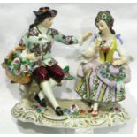 German Sitzendorf porcelain figurine of a couple sitting together with flowers, L: 16 cm, D: 10