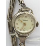 HORSHAM: ladies chromium cased manual wind wristwatch, on a sterling silver expanding bracelet,