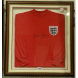 Nobby Styles signed England shirt. Excluding frame: P&P Group 1 (£14+VAT for the first lot and £1+